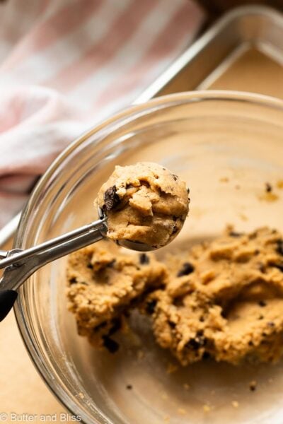 Generous scoop of chocolate chip cookie dough in a cookie scoop.