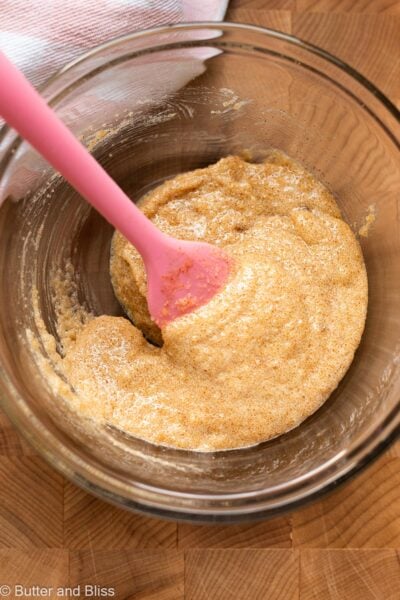 Mixed brown butter and sugar in a mixing bowl.