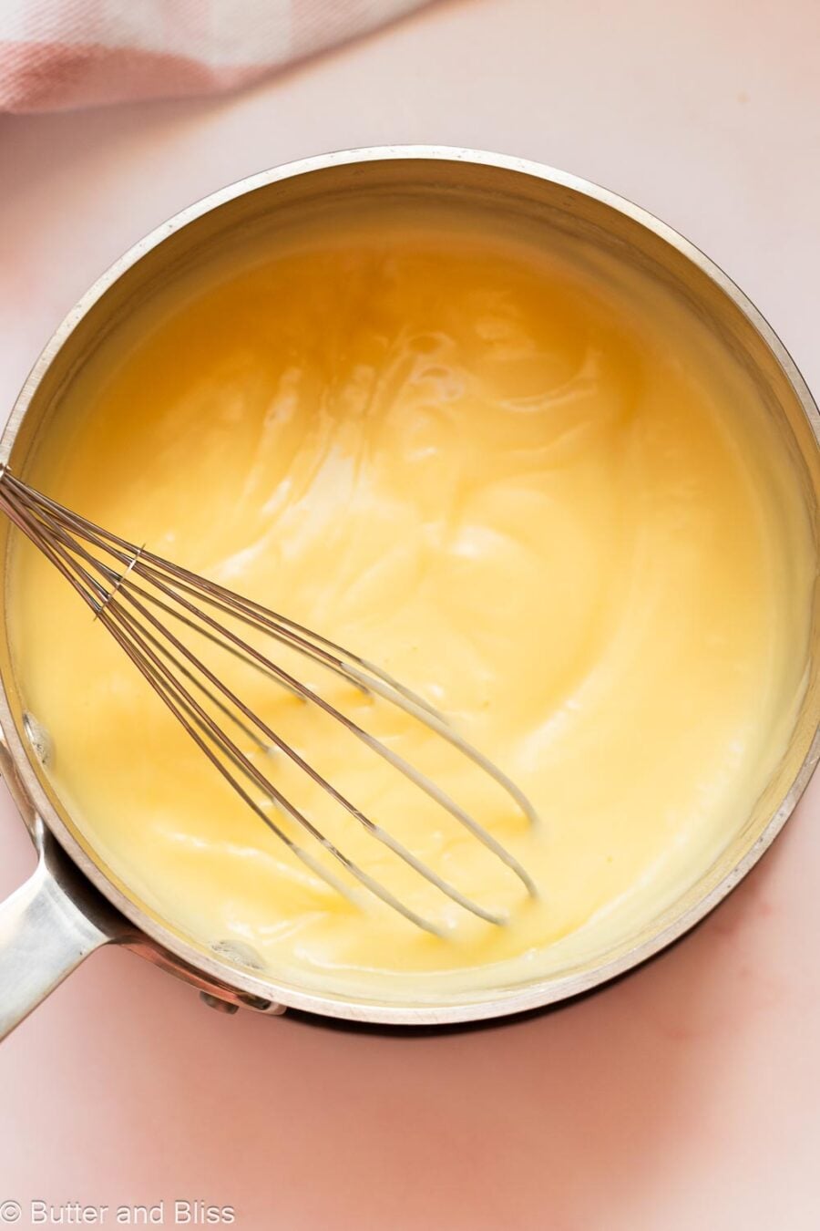 Smooth vanilla pudding in a saucepan.