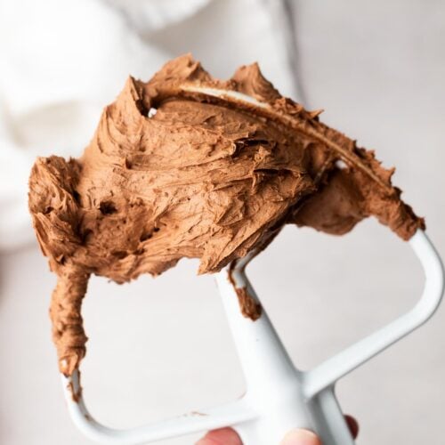 Fluffy chocolate buttercream on a mixer beater.