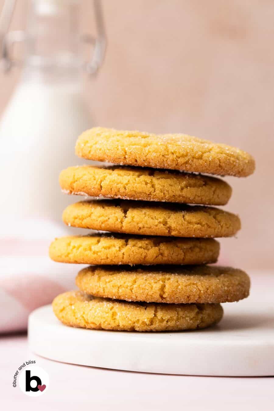 A stack of small batch chewy sugar cookies on a white plate.