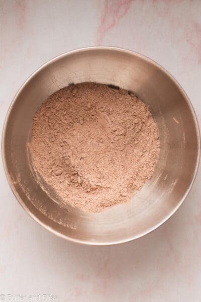 Dry ingredients for chocolate cupcakes in a mixing bowl.