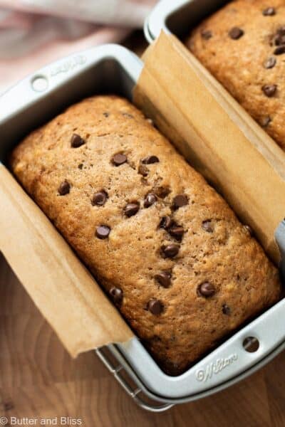 Fresh baked mini chocolate chip banana bread in a mini loaf pan.