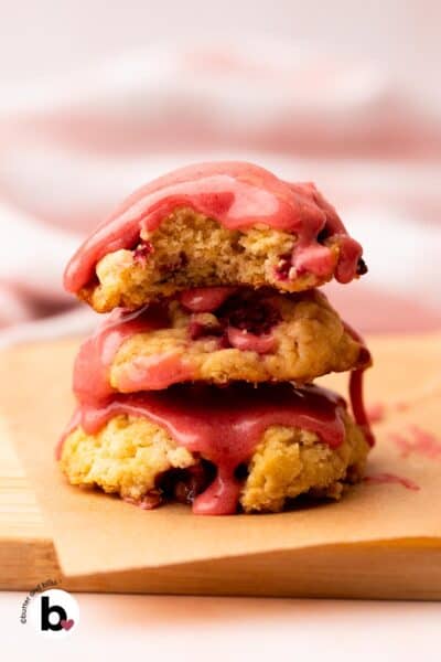 Strawberry glaze drizzled over a stack of cookies.