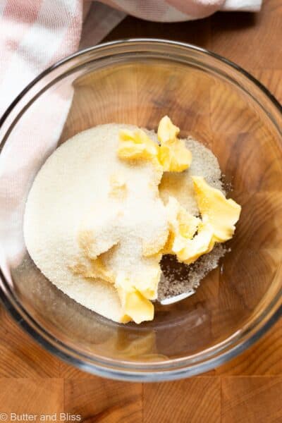Butter and sugar cubes in a mixing bowl.