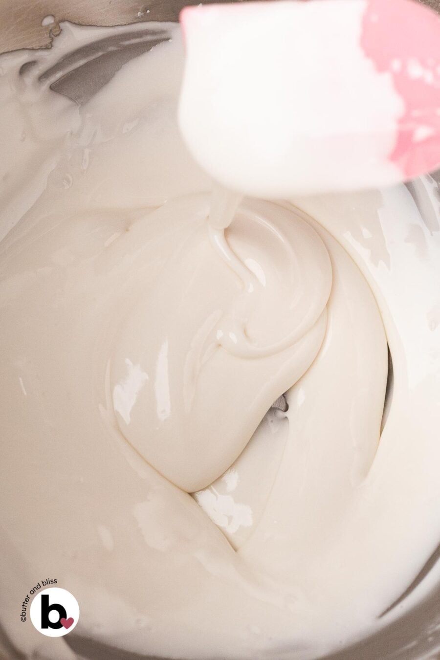 Testing the 10-second rule for royal icing, as the drip disappears into the surface.