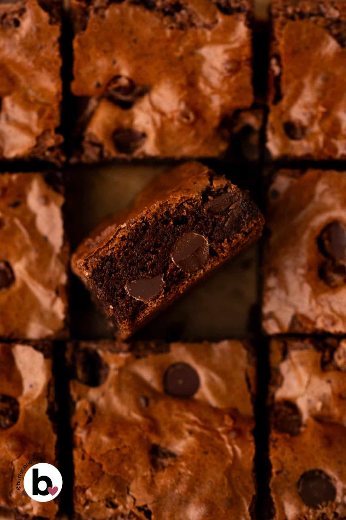 Fudgy inside of a brownie square surround by crinkly top brownies.