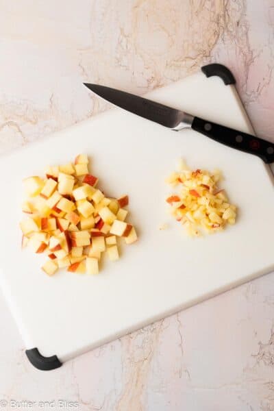 Apple cut into different sized pieces for muffins.