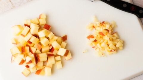 Apple cut into different sized pieces for muffins.