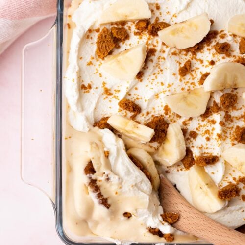 Wood spoon serving thich and creamy Biscoff banana pudding.
