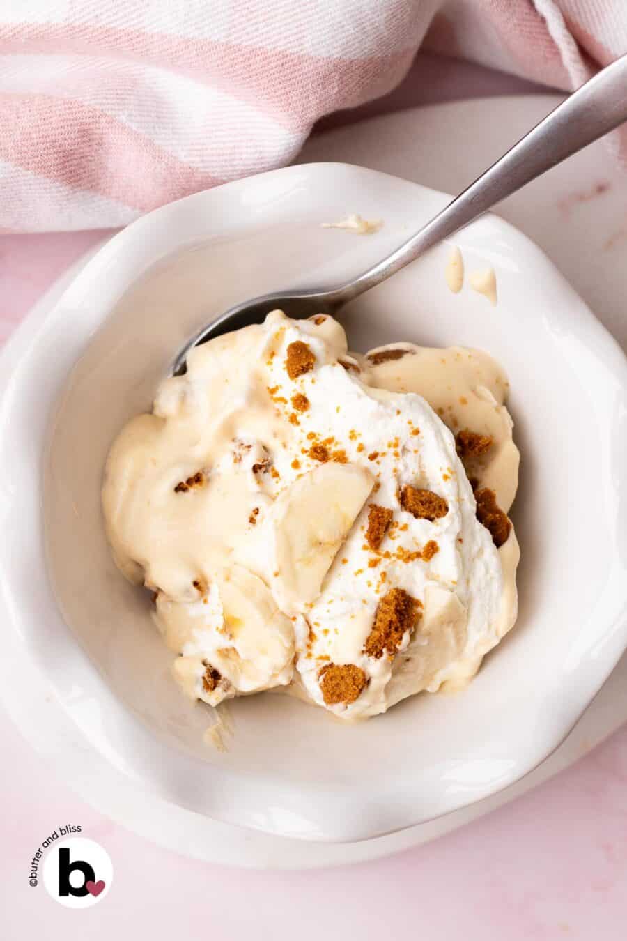 Small white bowl full of creamy Biscoff banana pudding.