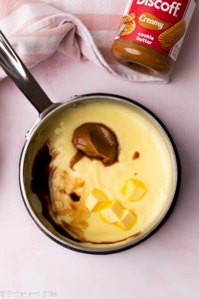 Vanilla pudding in a saucepan with Biscoff cookie butter and vanilla added.