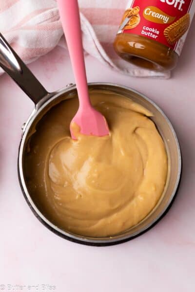 Thick and creamy Biscoff pudding in a small saucepan.