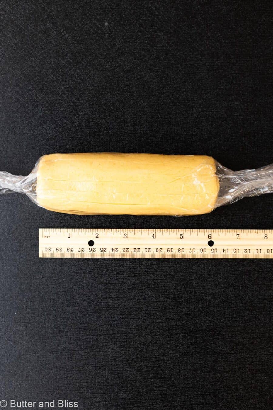 Butter cookie dough rolled into a 6-inch log.