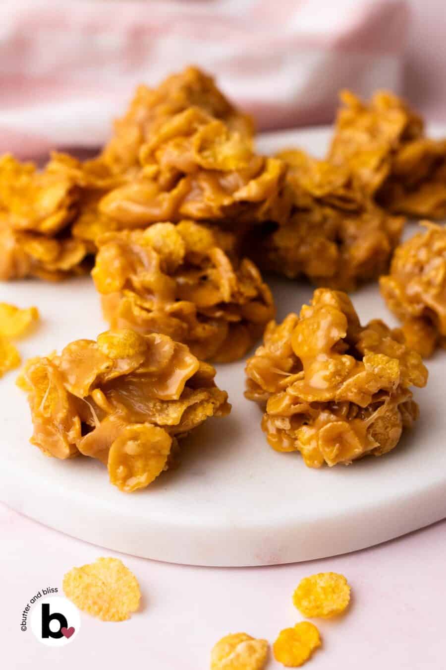 Small batch cornflake peanut butter no-bake cookies on a white plate.