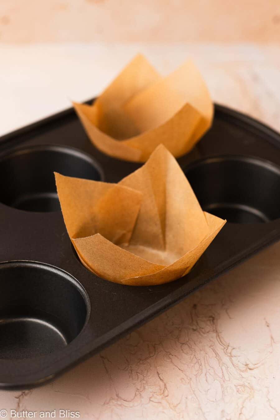 DIY tulip muffin liners in a muffin pan.