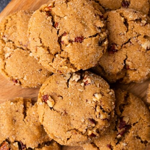 Small batch pecan brown sugar cookies piled on a wood plate.