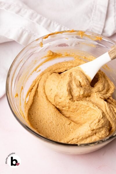 Super creamy creamed butter, peanut butter, and sugar in a mixing bowl.