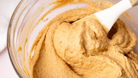 Super creamy creamed butter, peanut butter, and sugar in a mixing bowl.