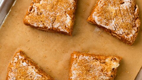 Small batch pumpkin spice scones cut into 4 wedges and placed on a baking sheet, to be baked.