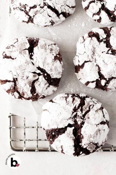 Small batch chocolate crinkle cookies cooling on a wire rack.