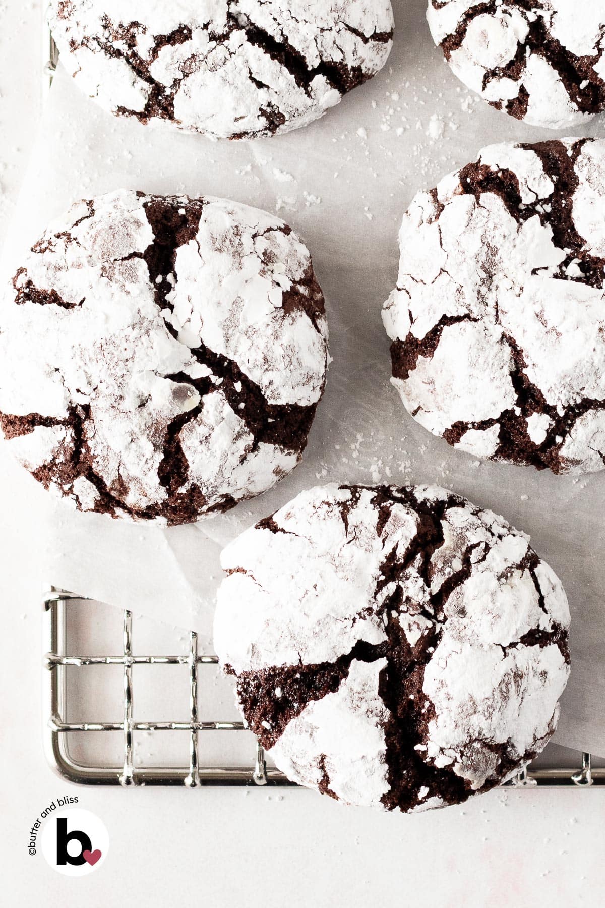 Small batch chocolate crinkle cookies cooling on a wire rack.